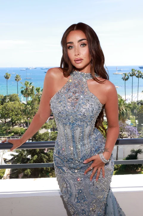 Crystal-embellished gown by the sea — luminous red carpet beauty by Aya Abdelhamid