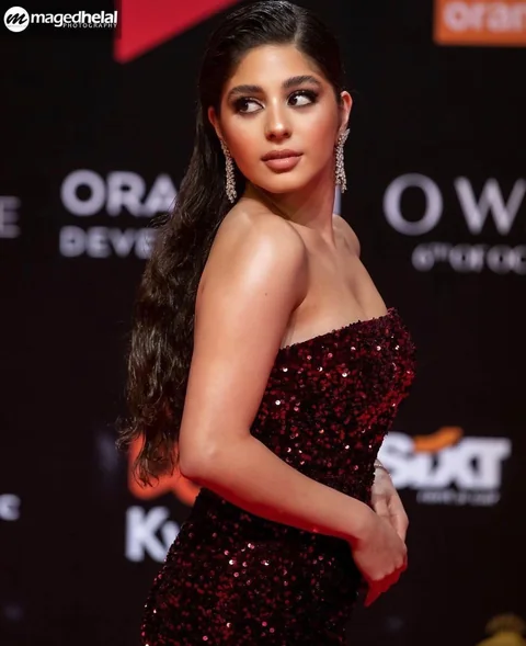 Red carpet glam in burgundy sequins — celebrity makeup for a festival premiere